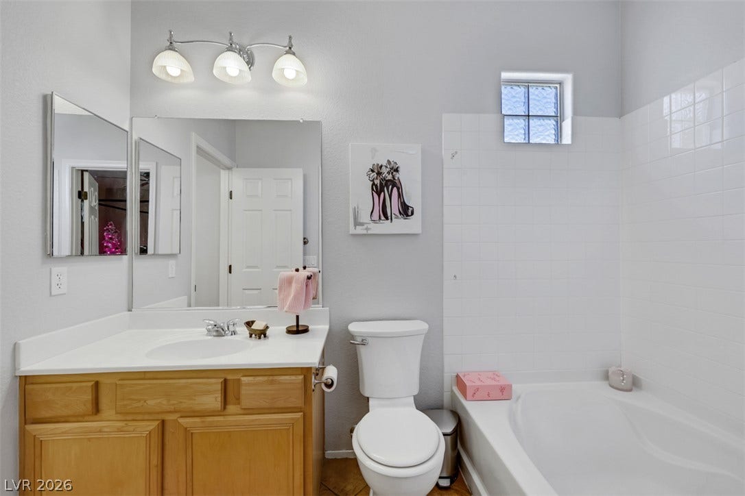 Primary bath with shower/ tub combo.