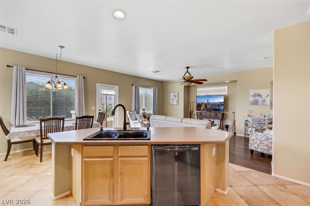 An open-concept layout connects the kitchen, dining area, and living space.