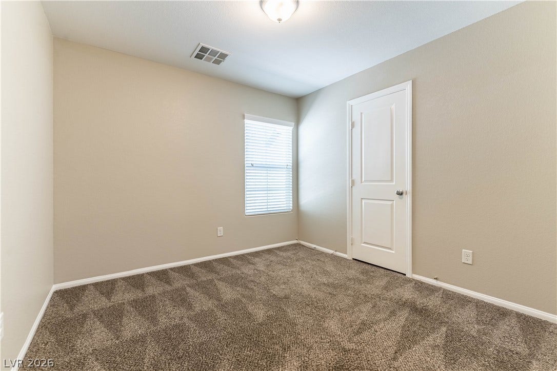891 Harbor Avenue, Henderson, NV 89002 Plush wall-to-wall carpeting and neutral walls define this versatile interior space.