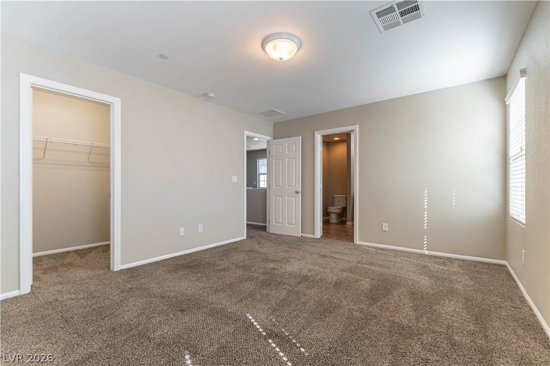 891 Harbor Avenue, Henderson, NV 89002 Plush carpeting and an attached closet define this comfortable primary suite layout.
