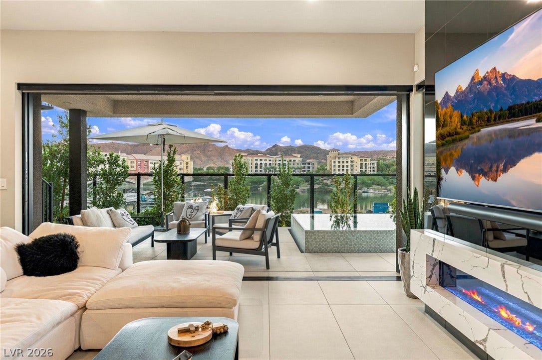 18 Heron Harbour Drive, Henderson, NV 89011 A seamless transition merges indoor living spaces with a private terrace overlooking the water.