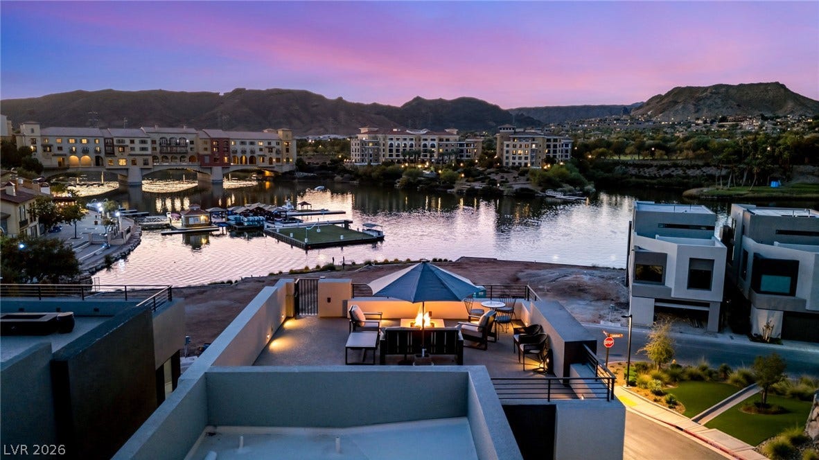 18 Heron Harbour Drive, Henderson, NV 89011 Dramatic mountain and water views provide a serene backdrop from the rooftop terrace.