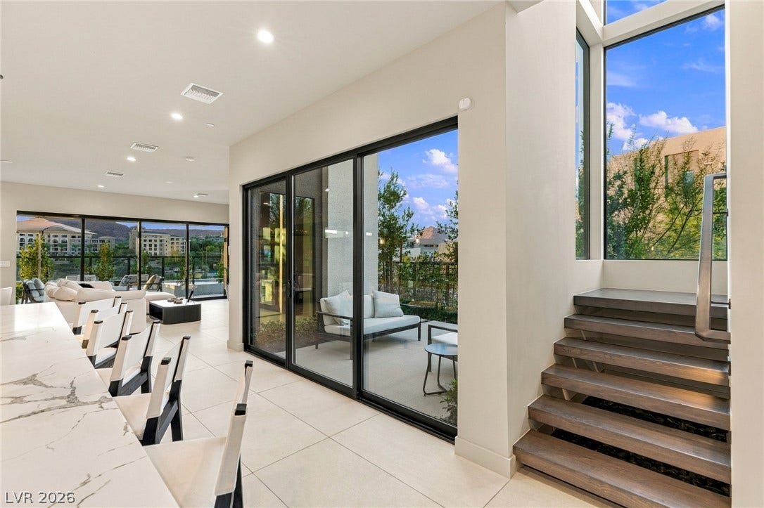 18 Heron Harbour Drive, Henderson, NV 89011 An open floorplan design seamlessly connects the sleek tiled living areas to the outdoors.