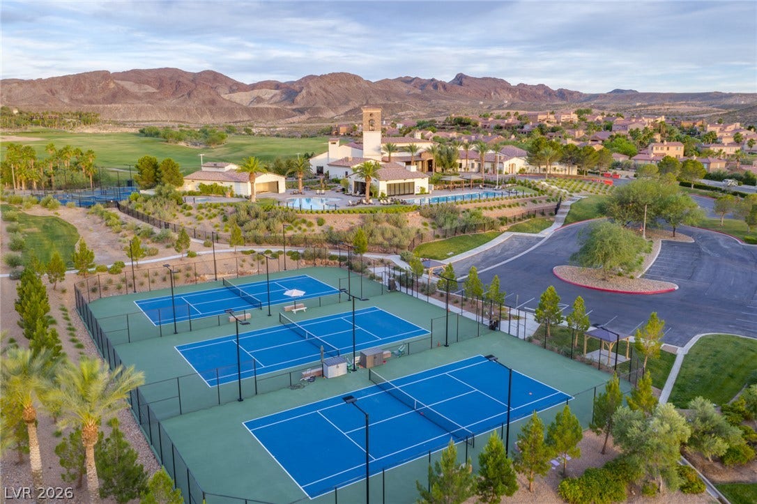 18 Heron Harbour Drive, Henderson, NV 89011 Professional sports courts offer outdoor recreation against a majestic mountain backdrop.