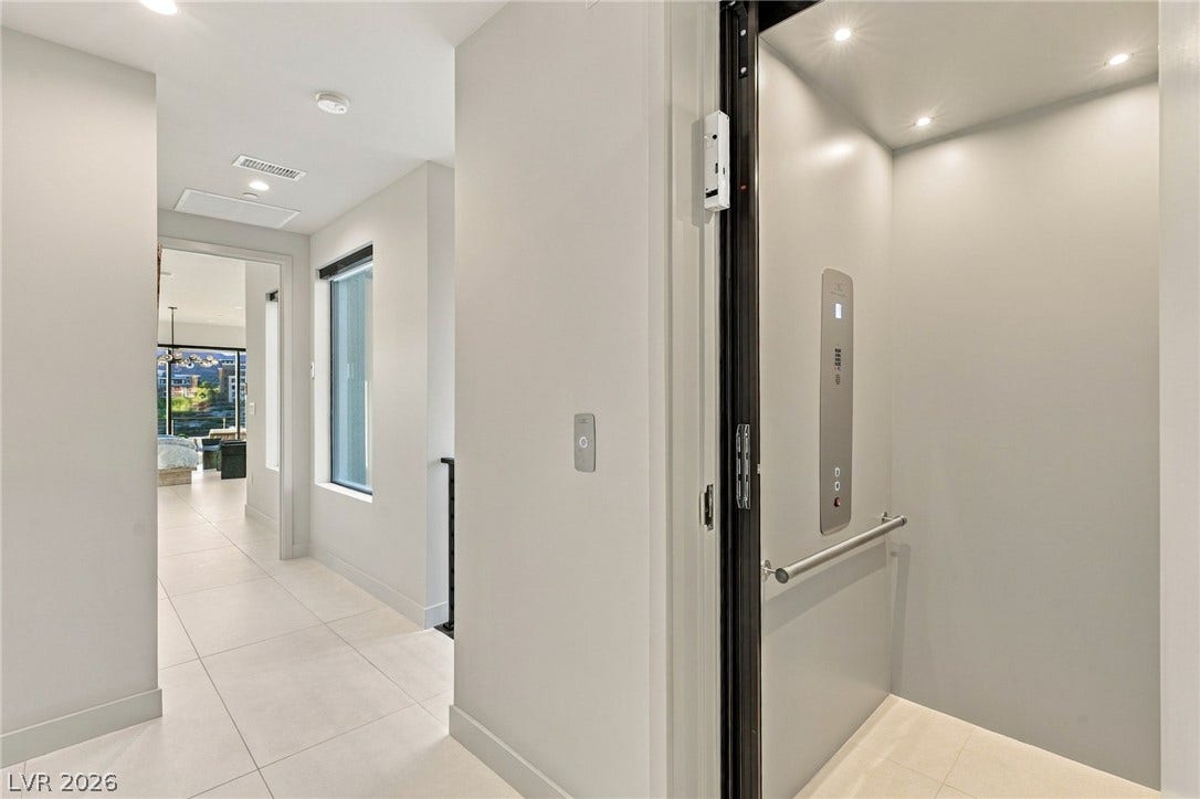 18 Heron Harbour Drive, Henderson, NV 89011 Modern hallways feature sleek tile flooring and a convenient private elevator.