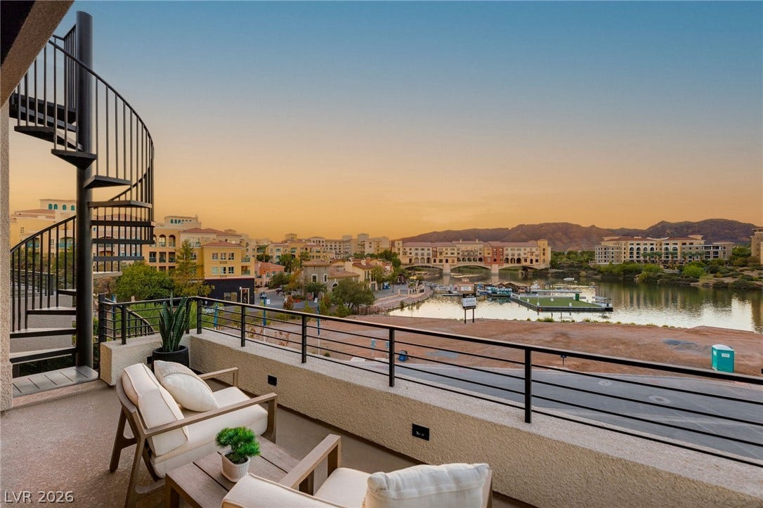 18 Heron Harbour Drive, Henderson, NV 89011 Panoramic mountain and water views unfold from this elevated terrace with a spiral staircase.
