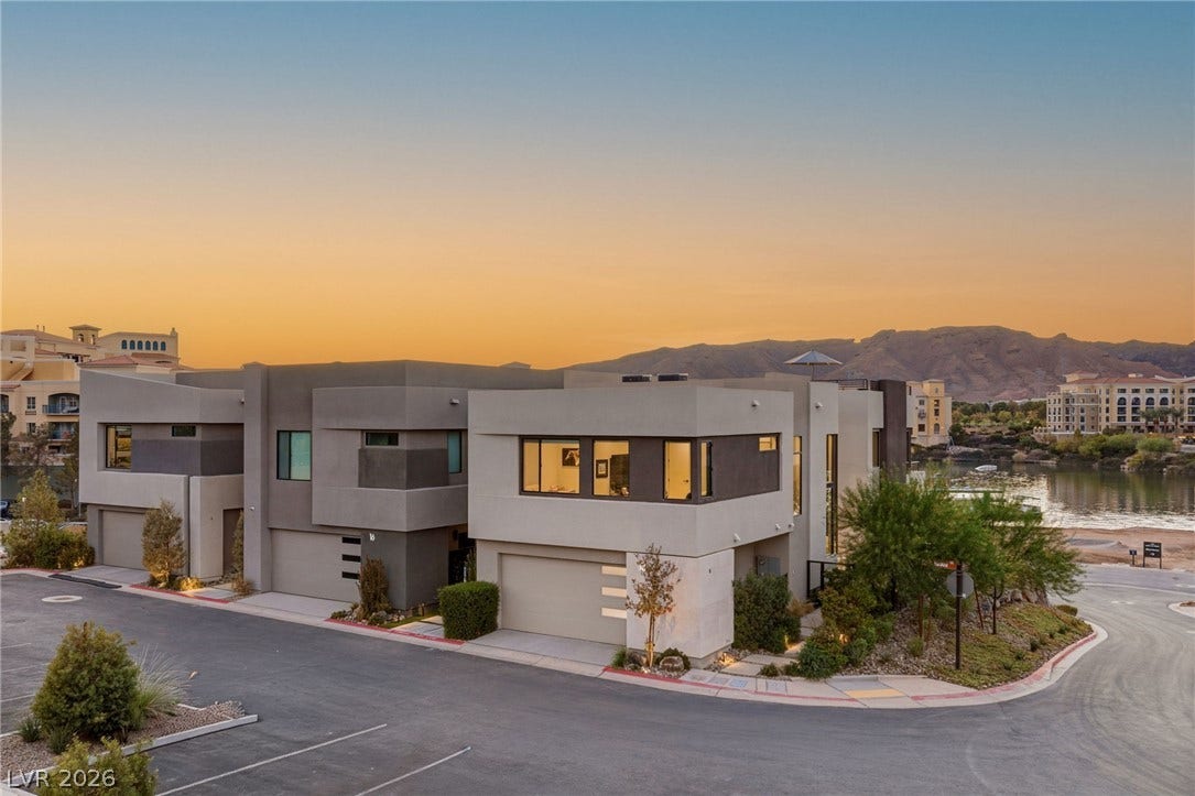 18 Heron Harbour Drive, Henderson, NV 89011 Striking contemporary architecture stands out against a dramatic desert mountain backdrop.