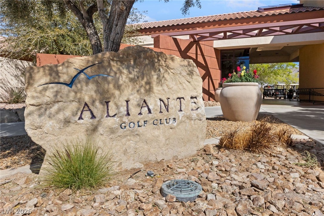 7340 Shelduck Street, North Las Vegas, NV 89084 A stone monument sign marks the entrance to the community clubhouse and golf facilities.