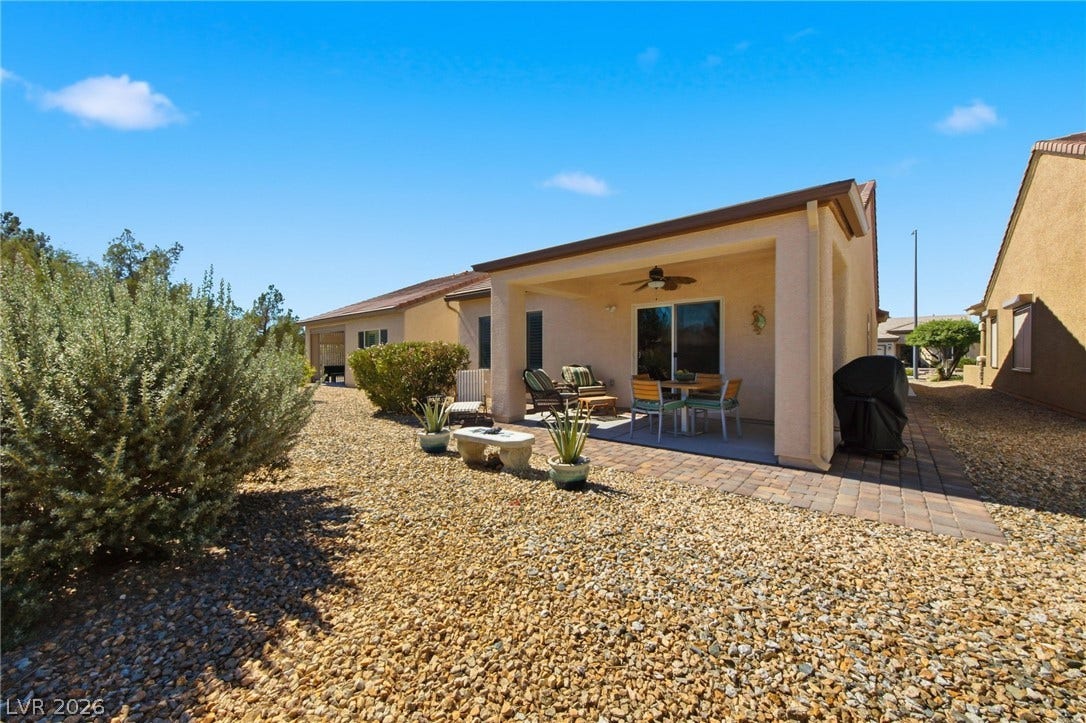 7340 Shelduck Street, North Las Vegas, NV 89084 A covered back porch opens to a gravel yard with low-maintenance desert plantings.