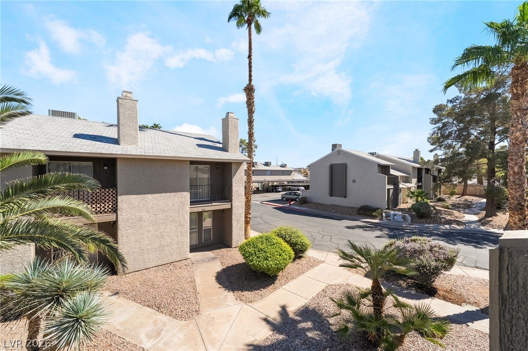 535 Sellers Place, Henderson, NV 89011 Lush desert landscaping lines the concrete walkways winding through this quiet residential community.