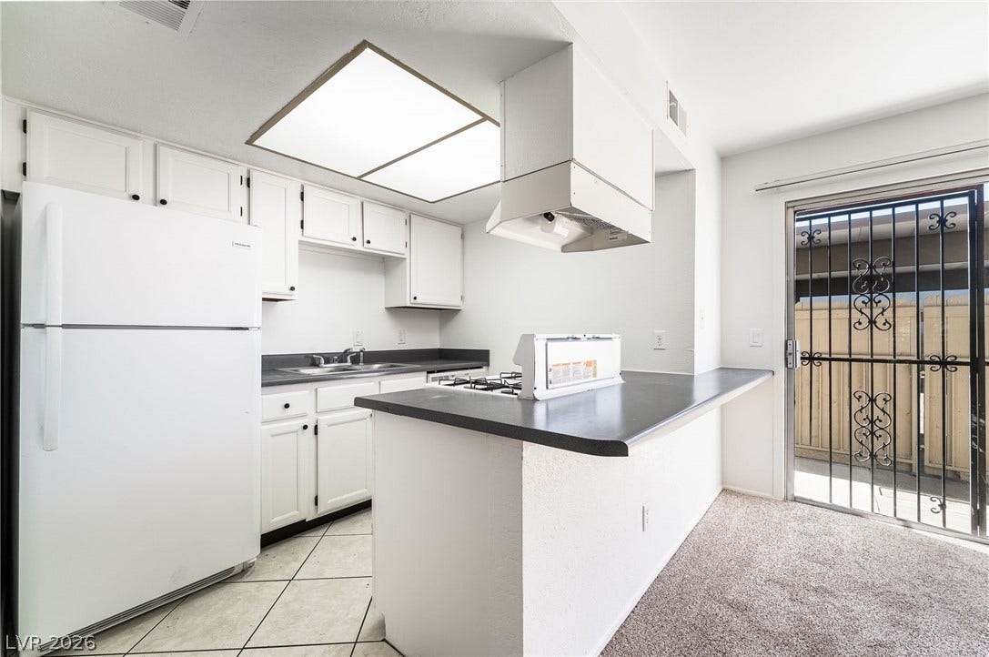 535 Sellers Place, Henderson, NV 89011 Sliding doors open to the outdoors from a functional kitchen with a practical breakfast bar.