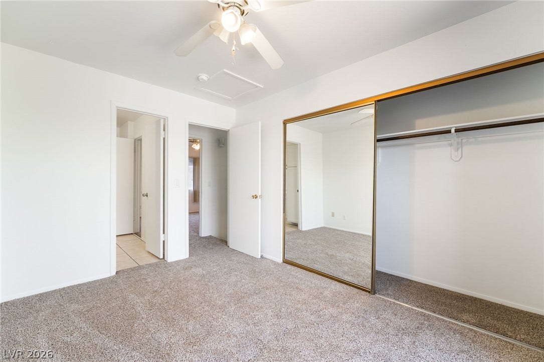 535 Sellers Place, Henderson, NV 89011 Plush wall-to-wall carpeting and a wide closet with mirrored sliding doors anchor the bedroom.