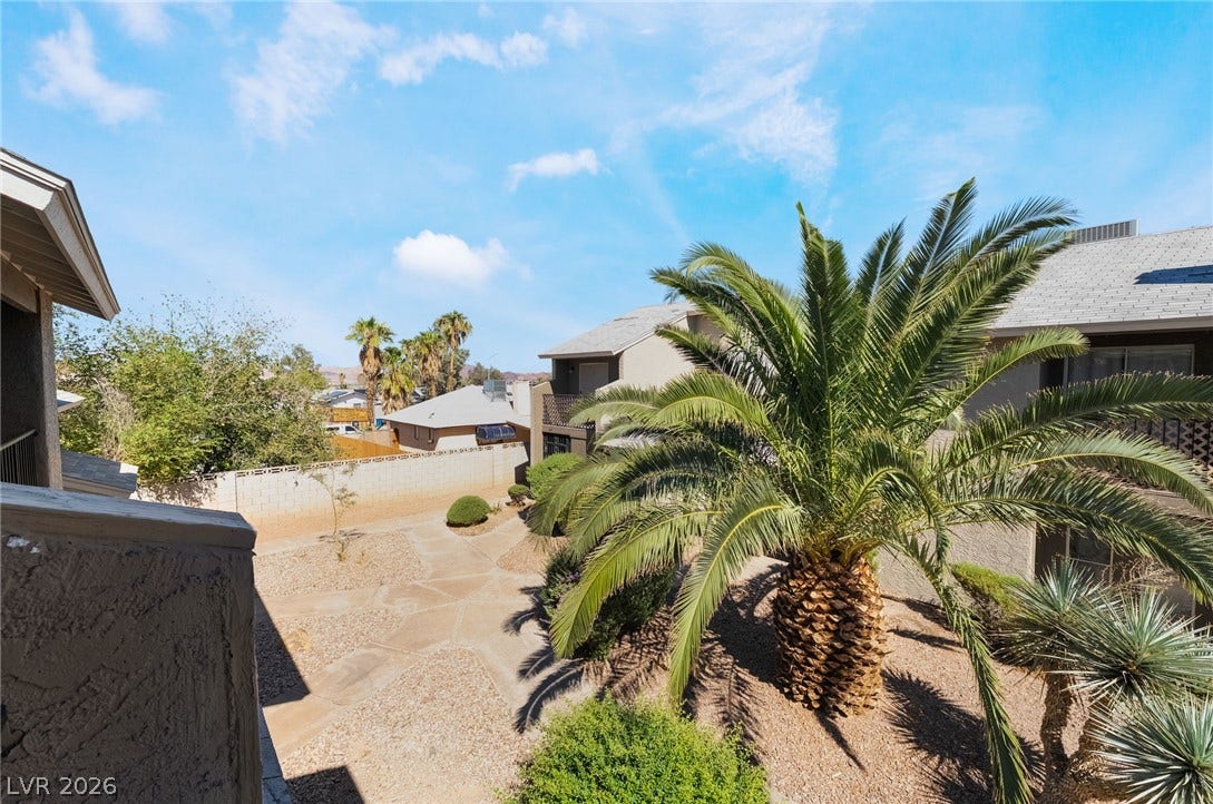 535 Sellers Place, Henderson, NV 89011 Lush palm trees frame the textured pathways winding through this desert landscape.
