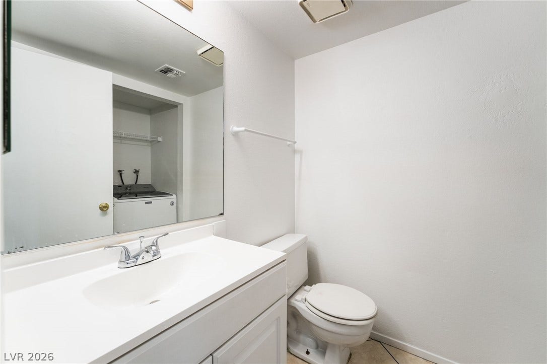 535 Sellers Place, Henderson, NV 89011 Clean lines and tiled flooring define this classic powder room.