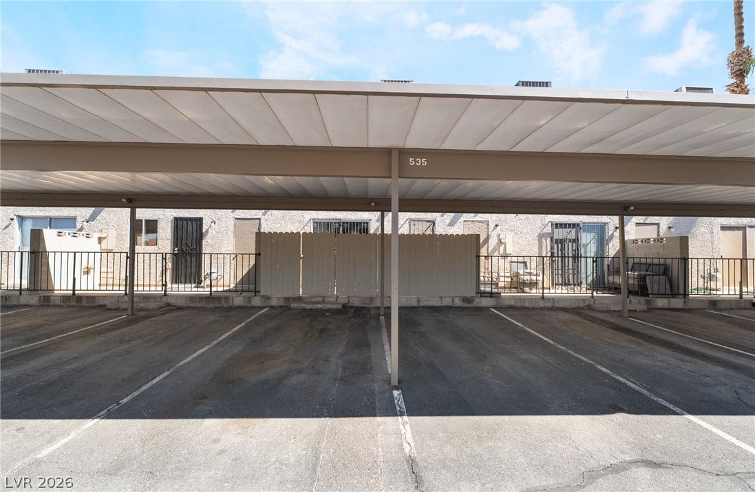 535 Sellers Place, Henderson, NV 89011 Convenient covered parking bays provide shelter alongside secure residential entry pathways.