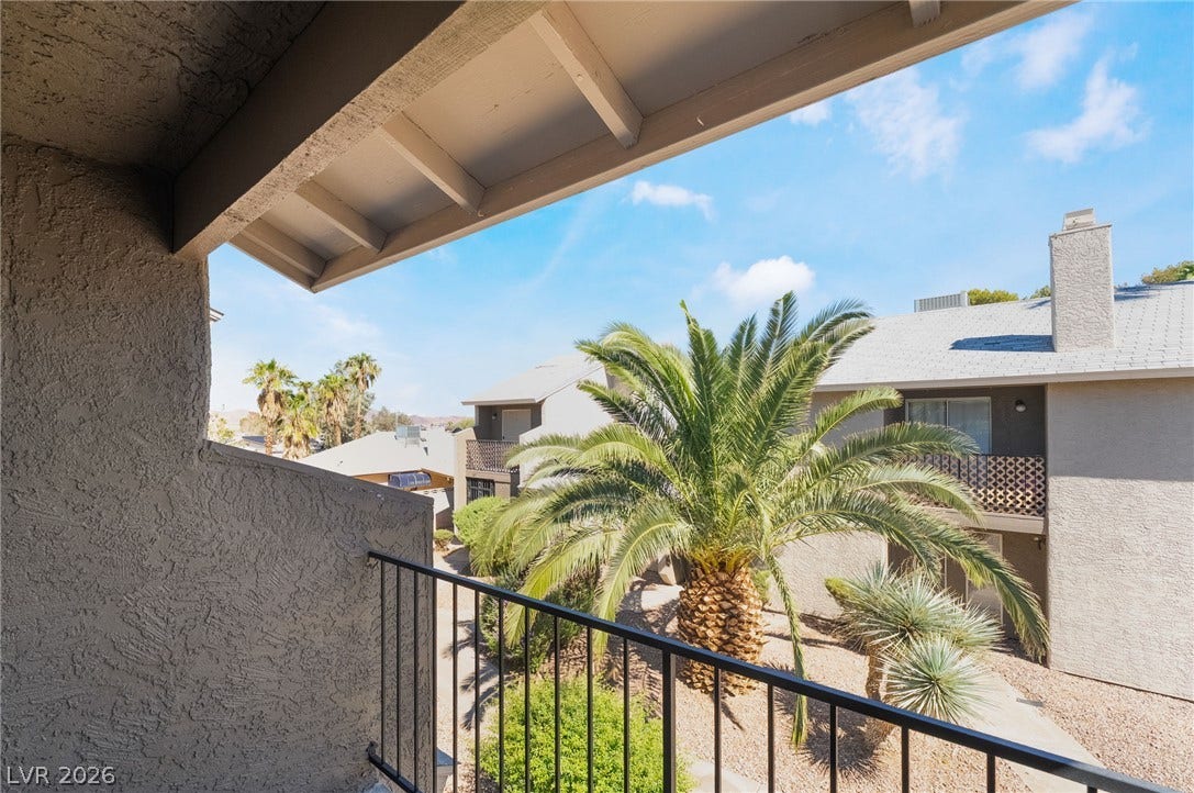 535 Sellers Place, Henderson, NV 89011 A private covered balcony provides peaceful views across the neighborhood's landscaped grounds.