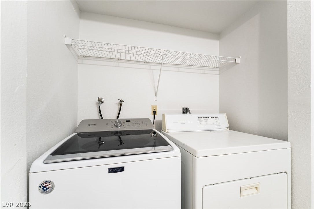 535 Sellers Place, Henderson, NV 89011 Functional utility space features overhead wire shelving and essential laundry connections.