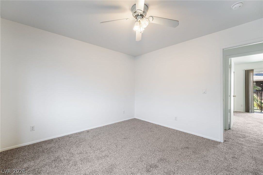 535 Sellers Place, Henderson, NV 89011 Plush carpeting anchors this versatile room offering a clean slate for personalization.
