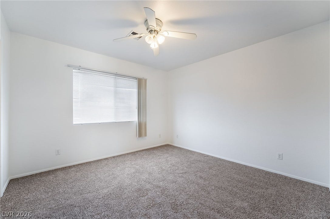 535 Sellers Place, Henderson, NV 89011 Plush wall-to-wall carpeting and clean neutral walls anchor this versatile second-floor space.