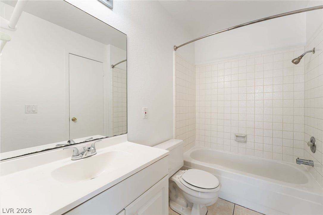 535 Sellers Place, Henderson, NV 89011 Clean lines and classic tiling define this functional, straightforward bathroom space.