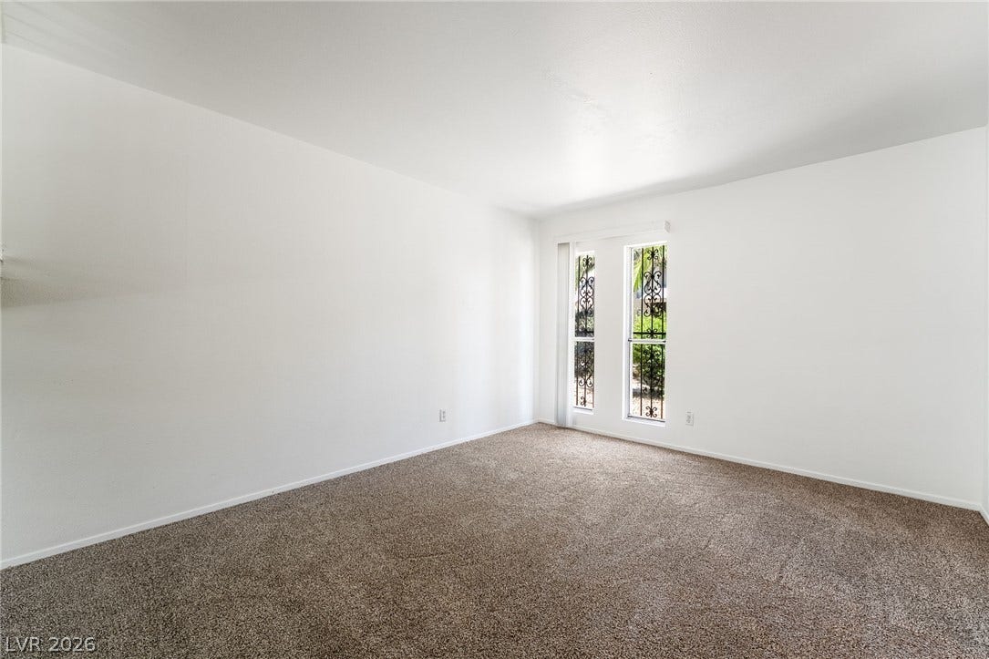 535 Sellers Place, Henderson, NV 89011 Smooth walls and classic carpeting define this clean, versatile interior space.