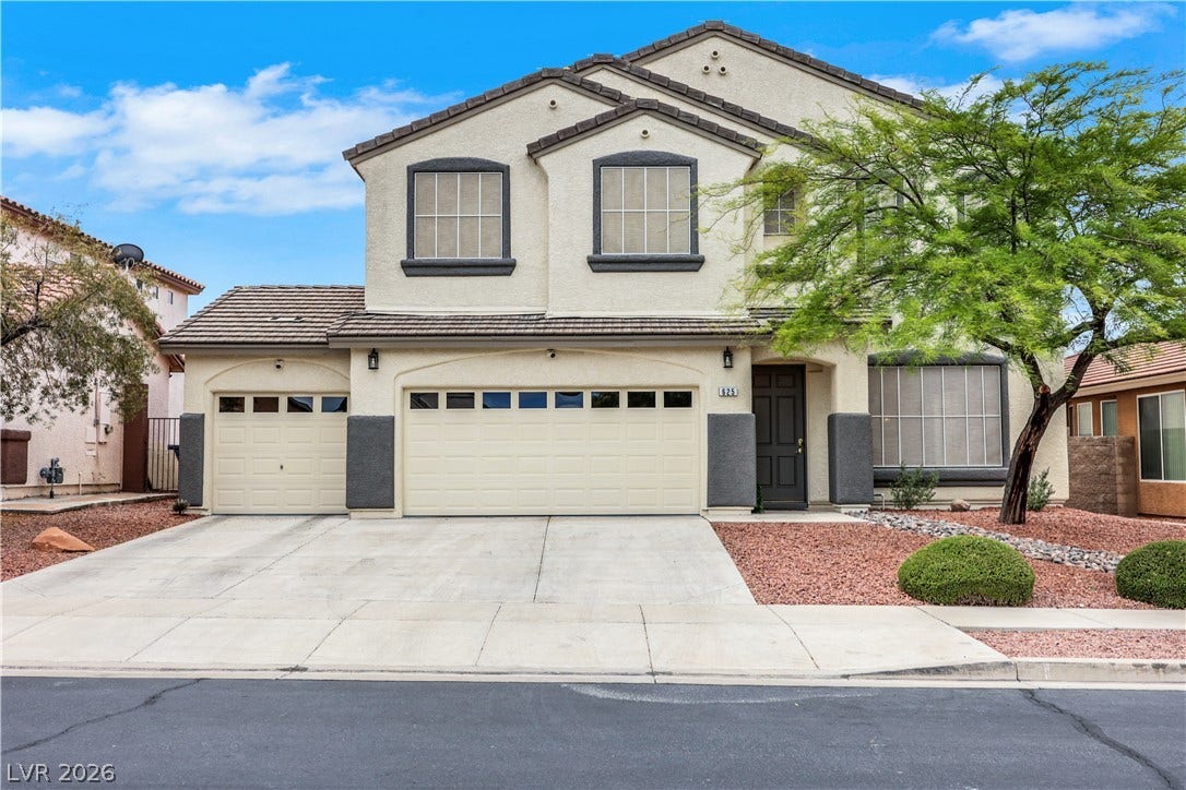 625 Bighorn Creek Street, Henderson, NV 89002 A two-story residence with a stucco facade and a two-car garage welcomes you home.