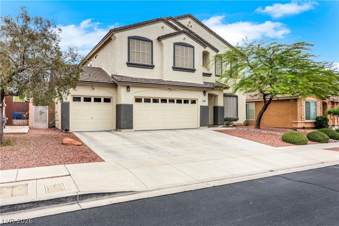 625 Bighorn Creek Street, Henderson, NV 89002 A well-maintained stucco home with a three-car garage offers inviting curb appeal.