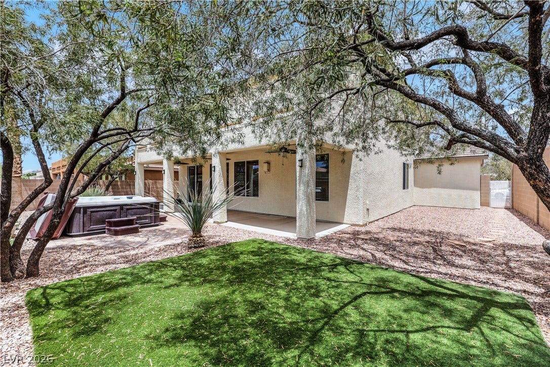 625 Bighorn Creek Street, Henderson, NV 89002 A private backyard retreat awaits with a soothing spa and a covered patio for ultimate relaxation.