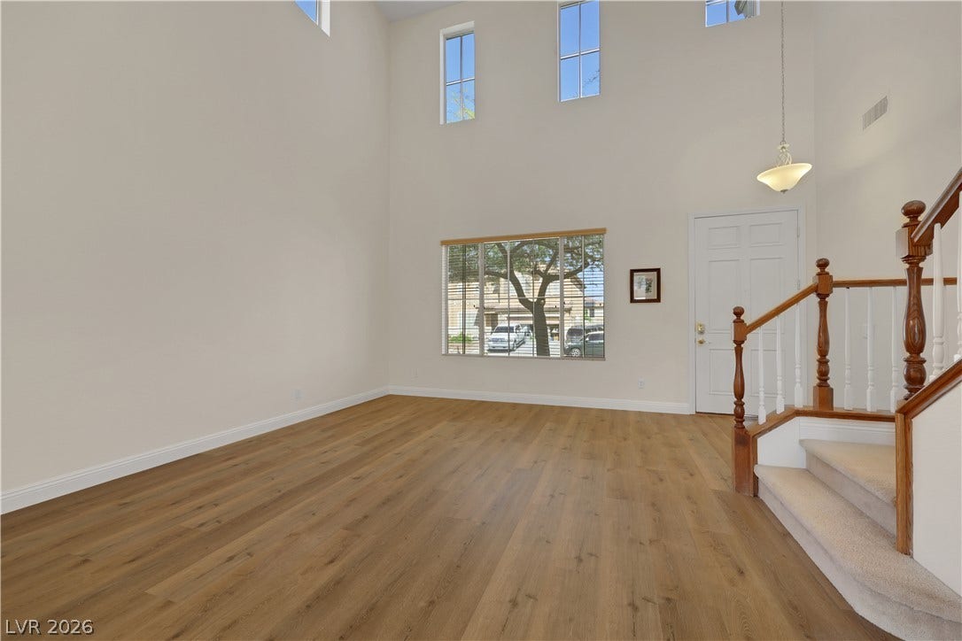 625 Bighorn Creek Street, Henderson, NV 89002 Towering ceilings and handsome wood-plank flooring define this light-filled formal entry.
