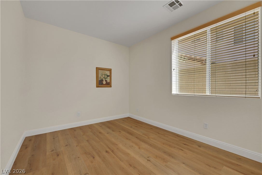 625 Bighorn Creek Street, Henderson, NV 89002 Smooth wood-style flooring and a large window define this versatile secondary space.