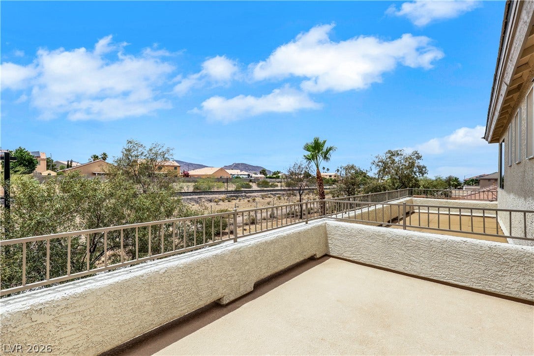 625 Bighorn Creek Street, Henderson, NV 89002 A spacious terrace offers sweeping vistas of the desert landscape and distant mountains.