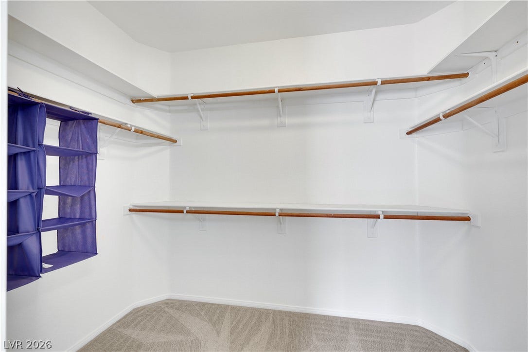625 Bighorn Creek Street, Henderson, NV 89002 Ample shelving and hanging space defines this well-organized walk-in closet.
