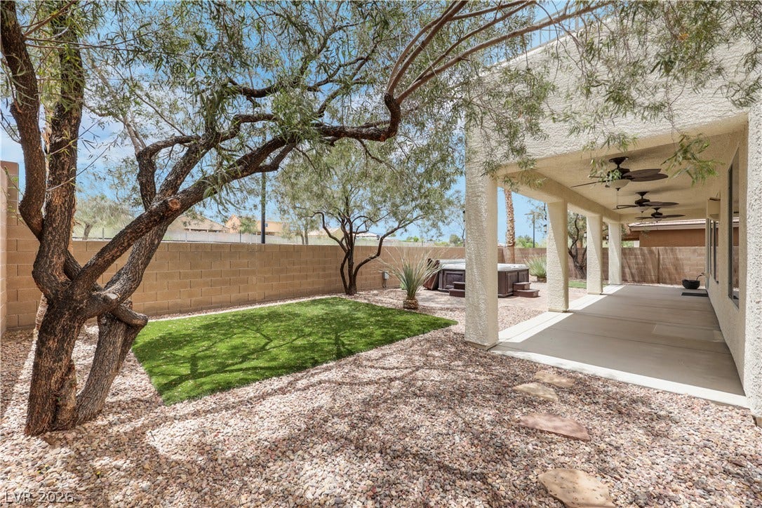 625 Bighorn Creek Street, Henderson, NV 89002 Relax in the private backyard oasis with a covered patio and inviting spa.