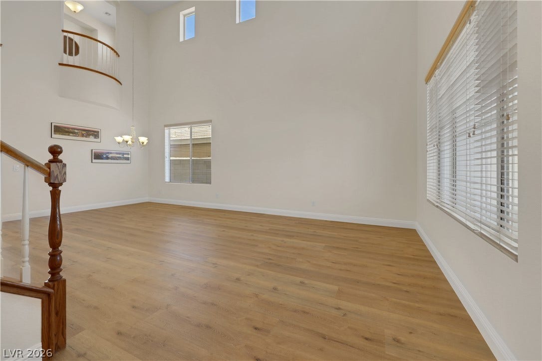 625 Bighorn Creek Street, Henderson, NV 89002 Towering ceilings and clean-lined wood flooring define this airy multi-level living area.