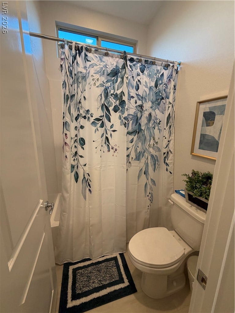 11725 Hatchling Avenue, Las Vegas, NV 89138 Natural light from a high window brightens this clean bathroom space.