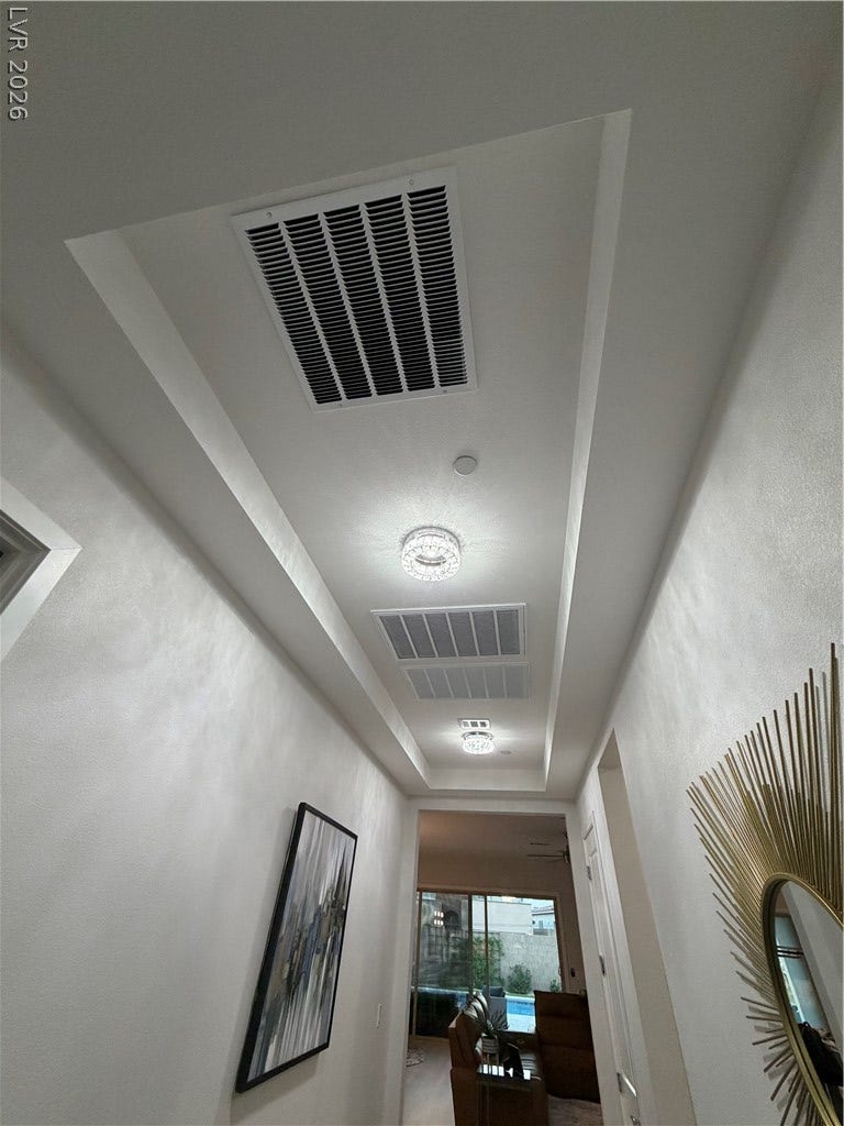 11725 Hatchling Avenue, Las Vegas, NV 89138 A long hallway boasts elevated architecture with a stylish recessed ceiling design.