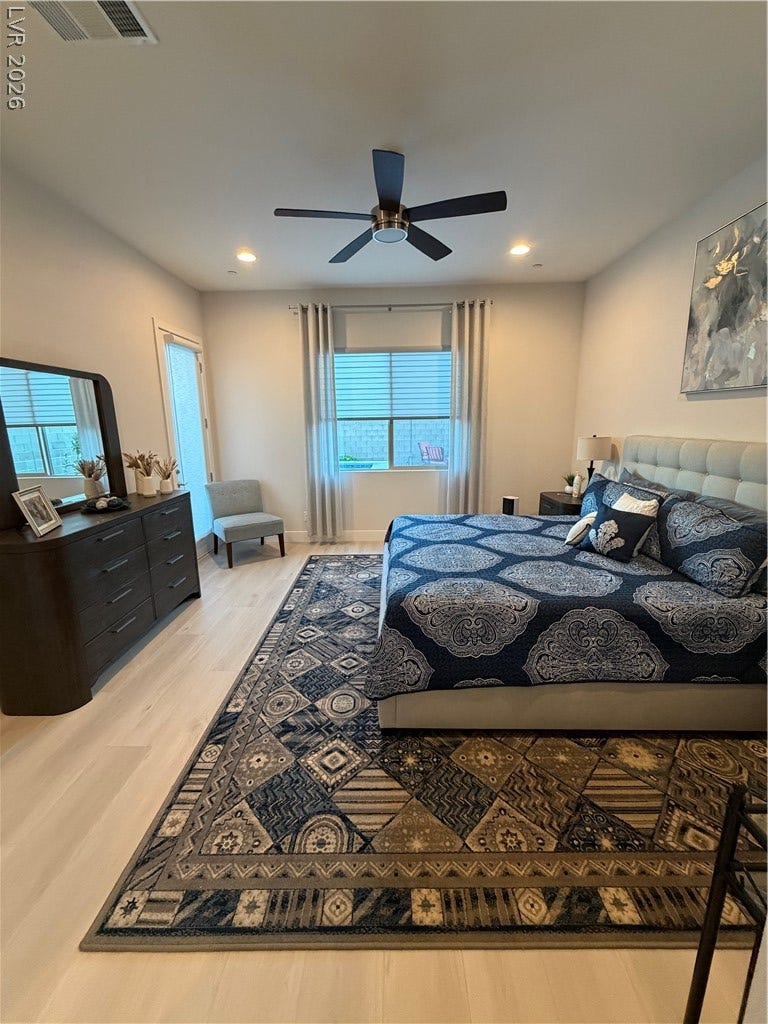 11725 Hatchling Avenue, Las Vegas, NV 89138 Recessed lighting and warm luxury vinyl flooring enhance this comfortable Master bedroom retreat.