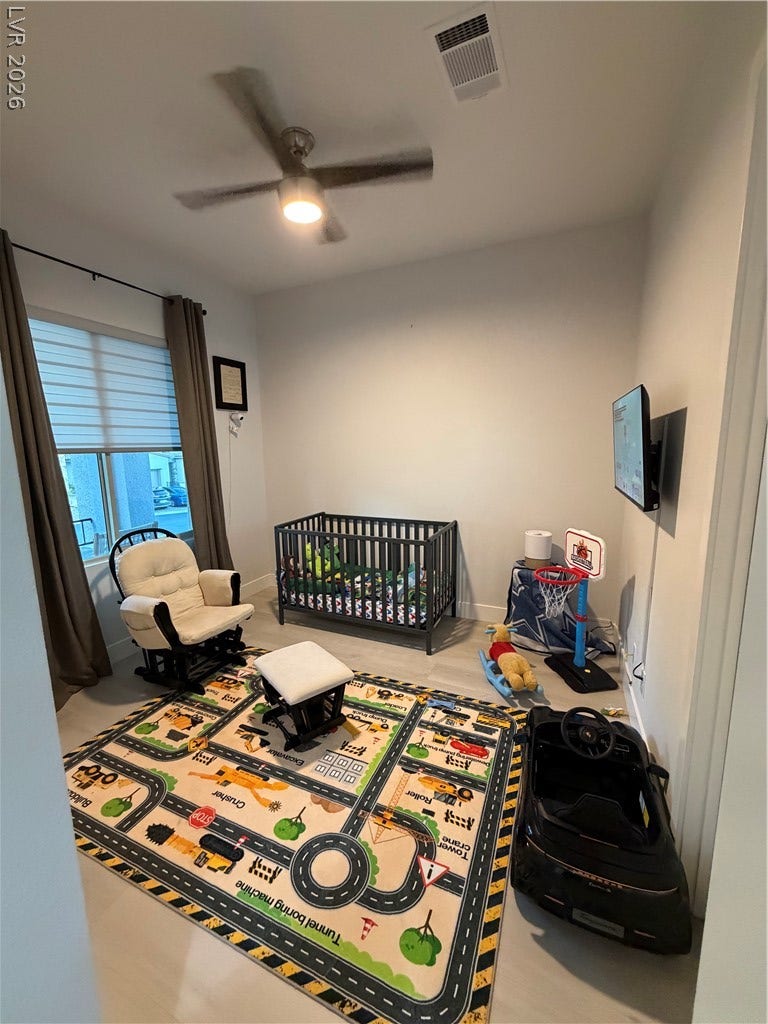 11725 Hatchling Avenue, Las Vegas, NV 89138 Smooth drywall finishes and wood flooring create a versatile base for this cozy bedroom space.