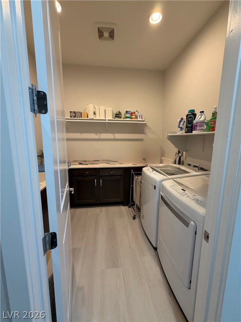 11725 Hatchling Avenue, Las Vegas, NV 89138 Functional laundry room features custom cabinetry and durable light luxuy vinyl flooring. Also features a sink.