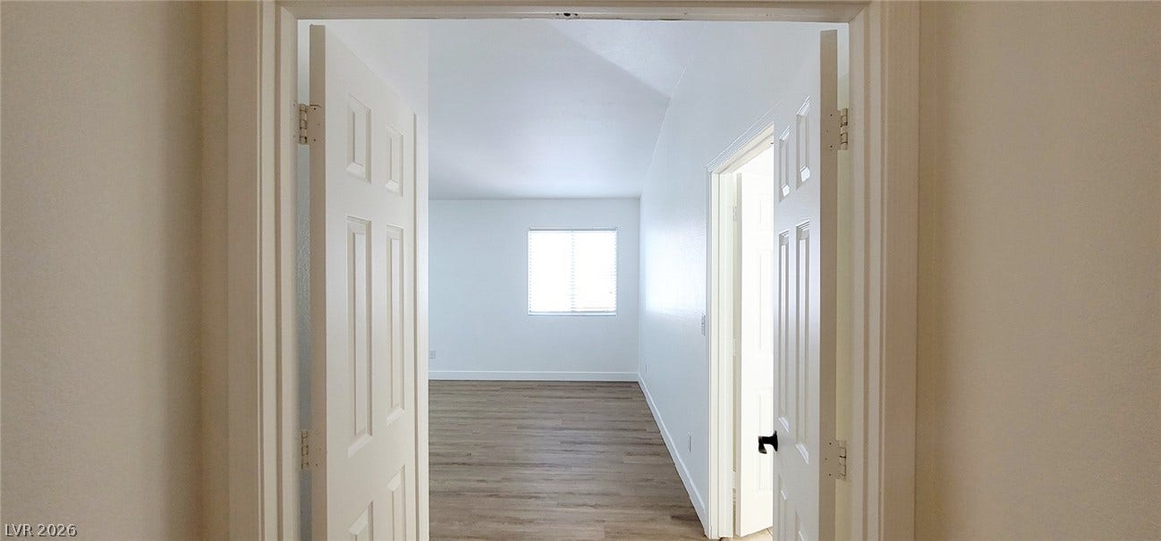 2001 Silverton Drive, Henderson, NV 89074 Double doors open to reveal vaulted ceilings and wood-look flooring.