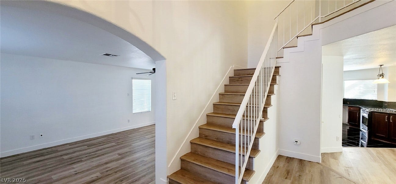 2001 Silverton Drive, Henderson, NV 89074 A spacious entryway features wood-look flooring and an elegant arched transition into the living room.