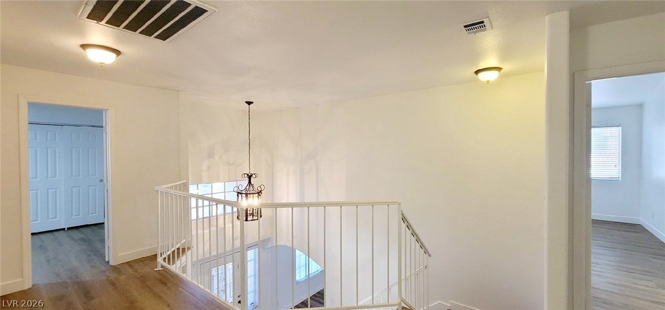 2001 Silverton Drive, Henderson, NV 89074 Gleaming wood floors and a light-filled open landing connect the upstairs living spaces.