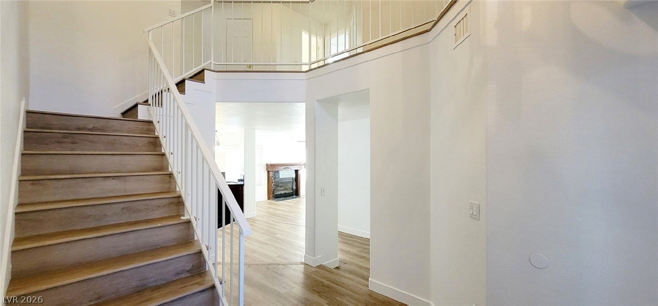 2001 Silverton Drive, Henderson, NV 89074 An airy entryway transitions seamlessly into the light-filled main level through open passageways.