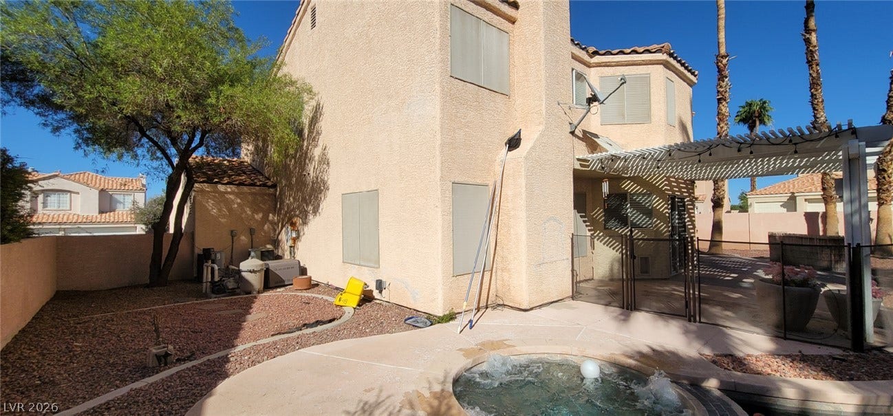 2001 Silverton Drive, Henderson, NV 89074 Stucco exterior walls and a red tile roof define this desert-inspired residential structure.
