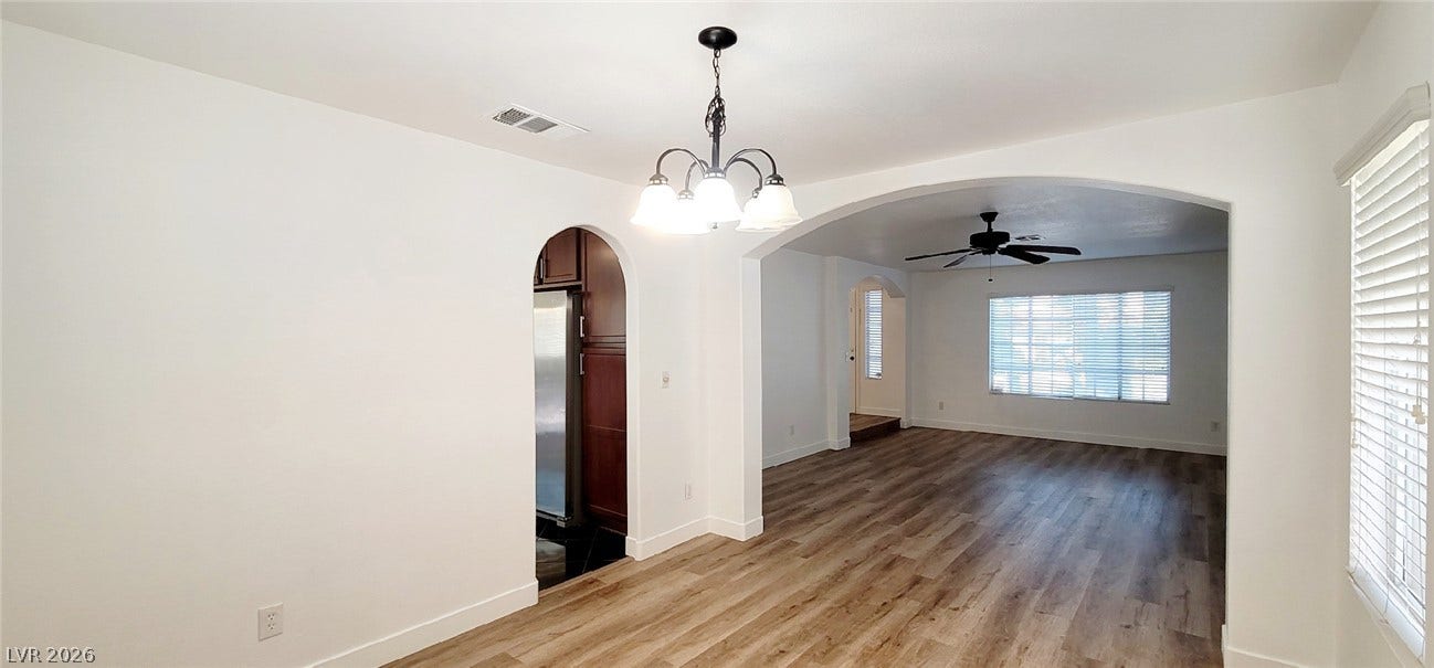2001 Silverton Drive, Henderson, NV 89074 Smooth archways connect the light-filled dining space to the open living areas.