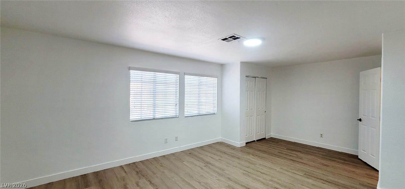 2001 Silverton Drive, Henderson, NV 89074 Gleaming wood-look floors pair perfectly with clean lines and abundant natural light.