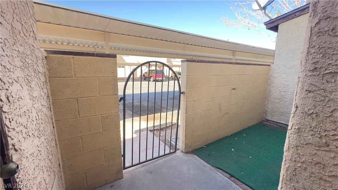 543 KRISTIN Lane, Henderson, NV 89011 Secure block fencing and a metal gate enclose this functional private patio space.