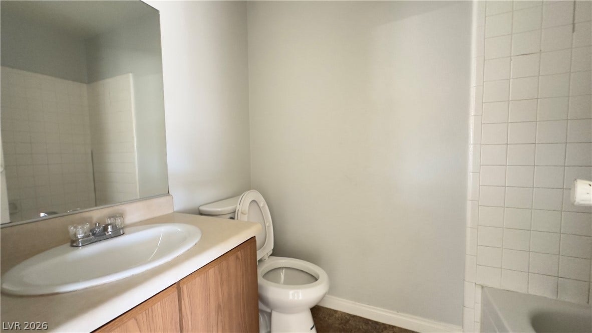 543 KRISTIN Lane, Henderson, NV 89011 Functional bathroom space includes a classic vanity adjacent to tiled tub surround.