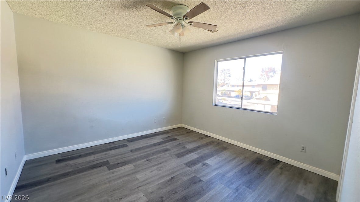 543 KRISTIN Lane, Henderson, NV 89011 Smooth walls and modern plank flooring anchor this versatile bedroom space.