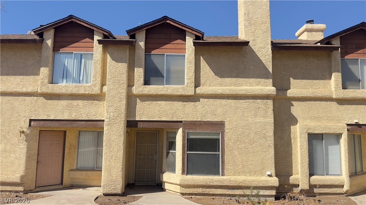 543 KRISTIN Lane, Henderson, NV 89011 Stucco exterior walls paired with classic wooden accents define this multi-level residential structure.